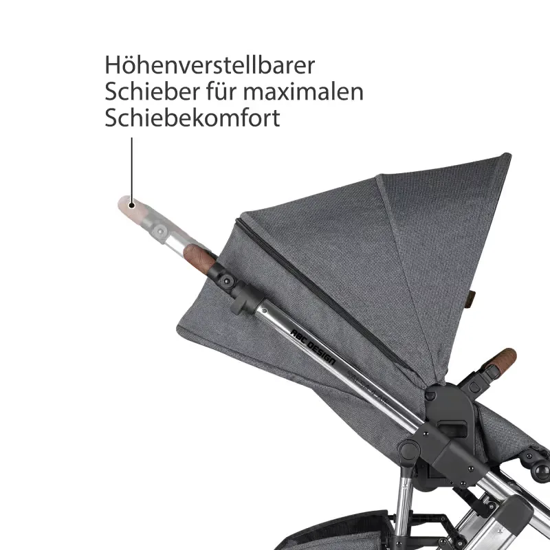 Kinderwagen der wird mit sitz und lenker gezeigt.